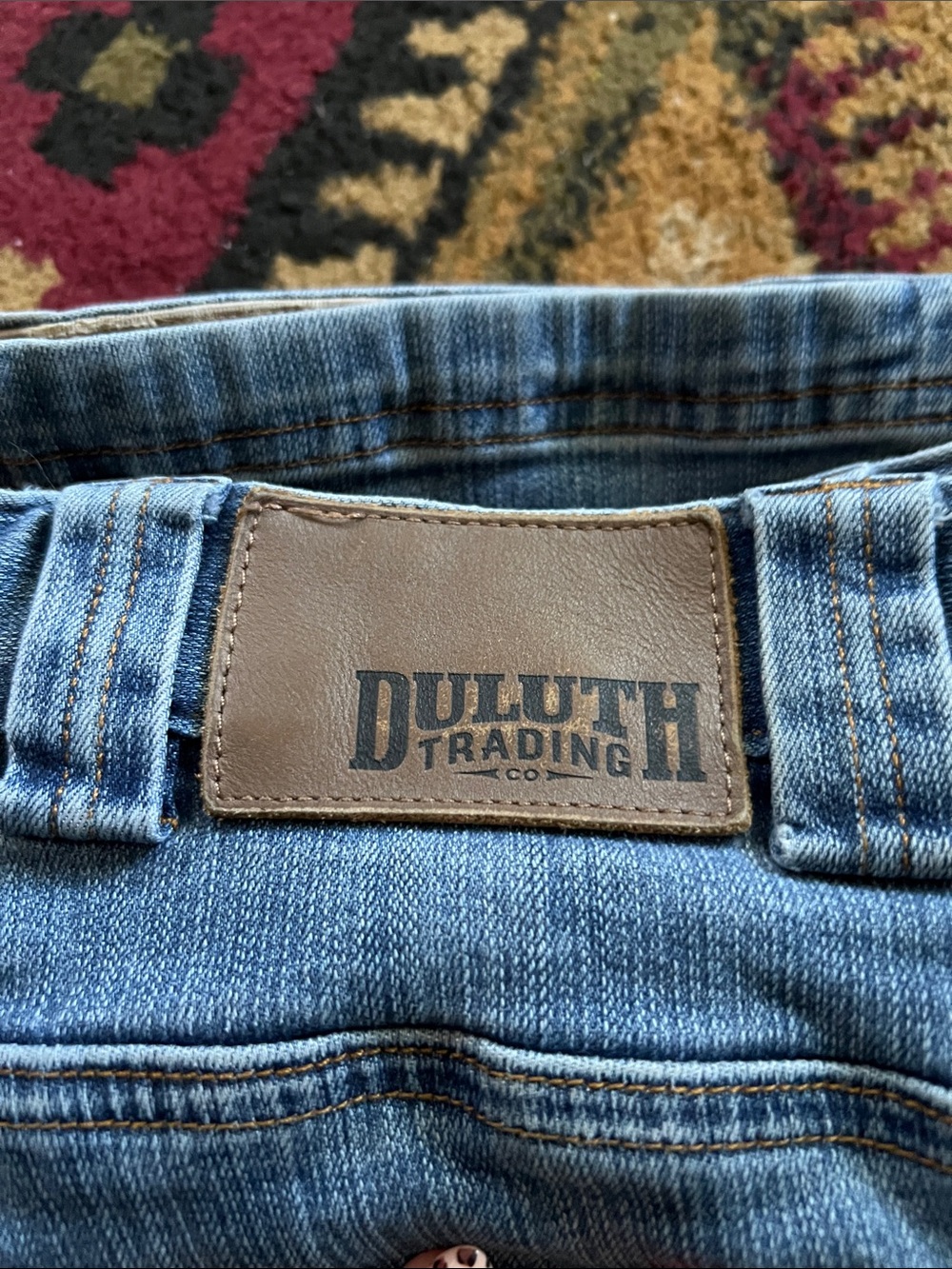 Duluth Trading Co Blue Denim Relaxed Fit Jeans with Brown Leather Patch